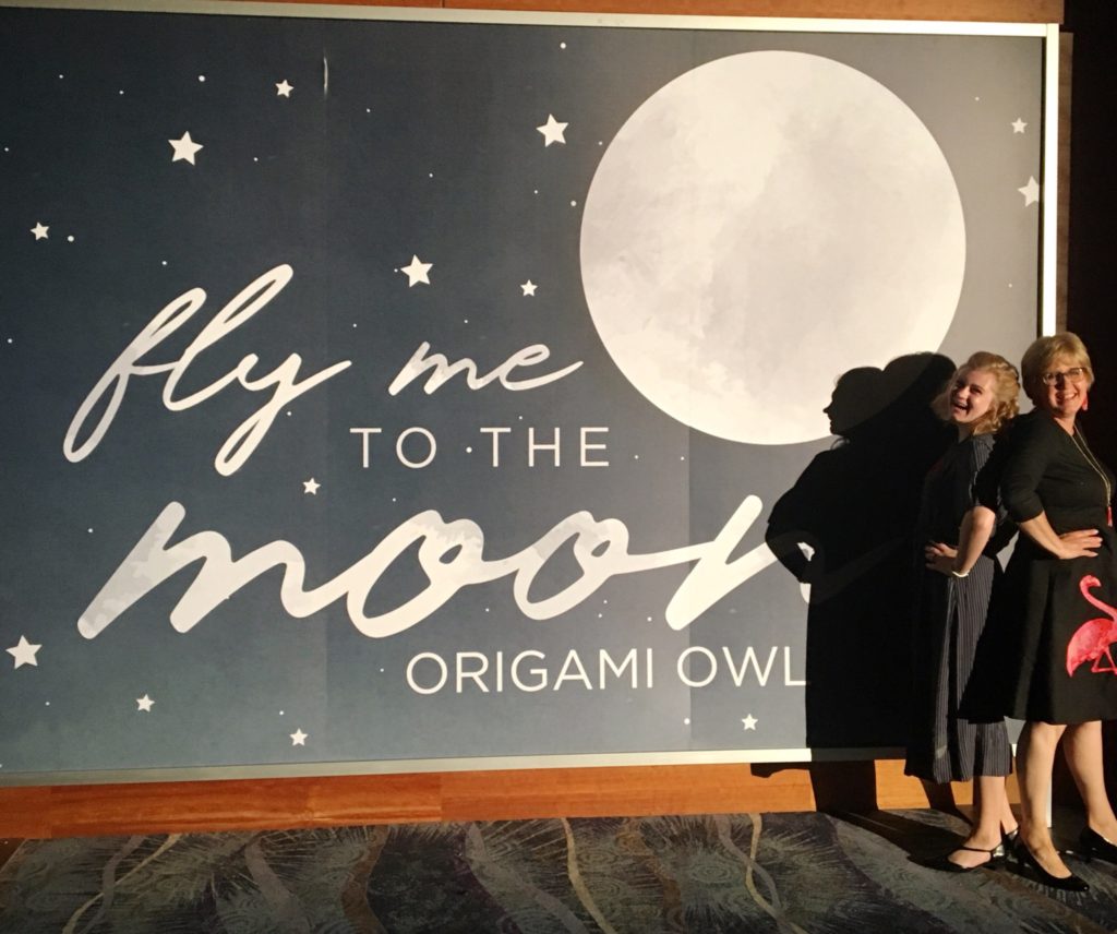 Posing by Fly me to the Moon wall