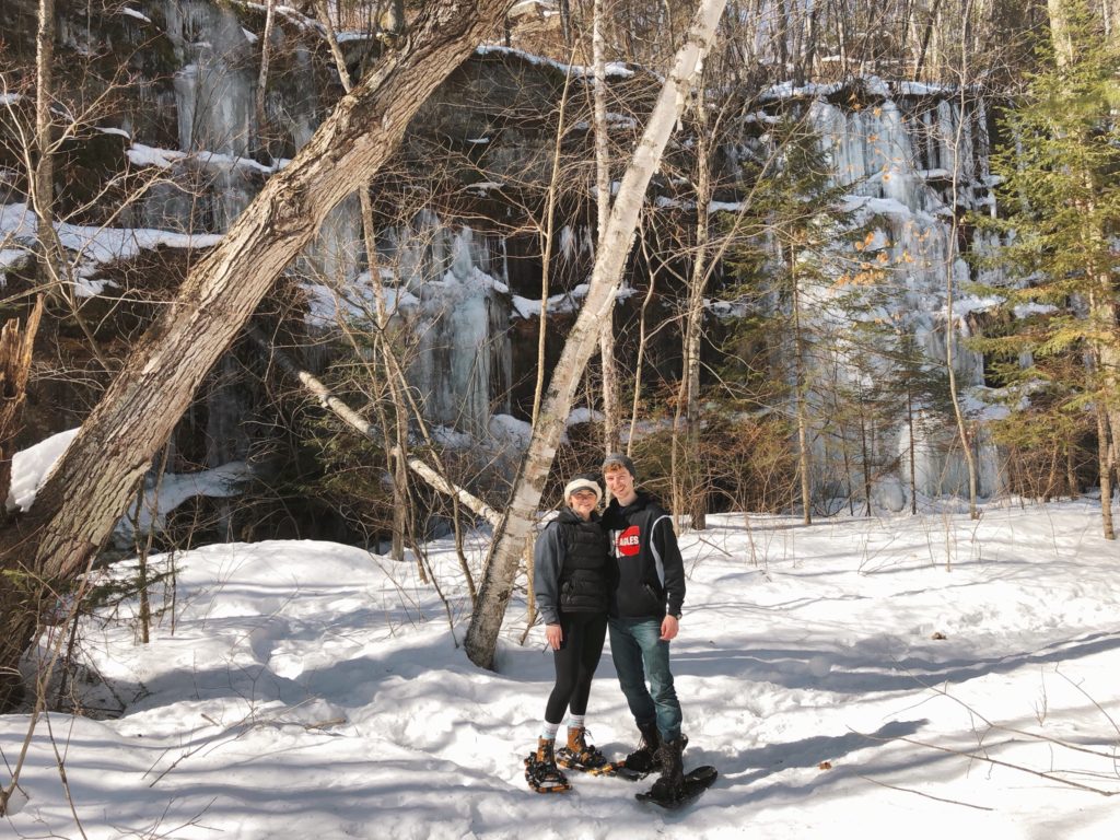 Hannah and Dylan in front of ice covered bluffs