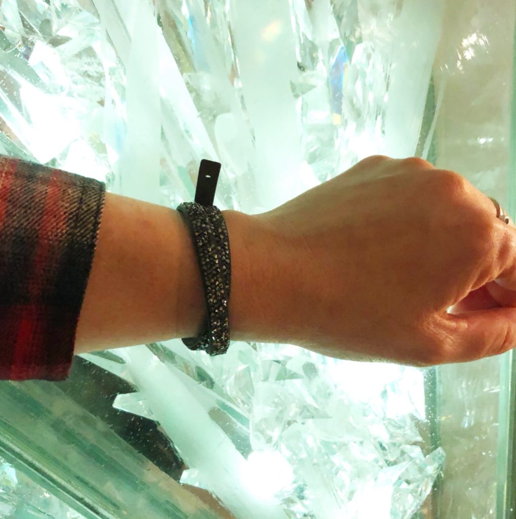 Swarovski Crystal Leather Wrap Bracelet in from of Swarovski Crystal wall